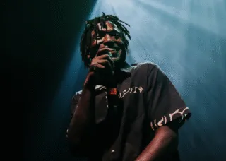 man in black shirt performing 